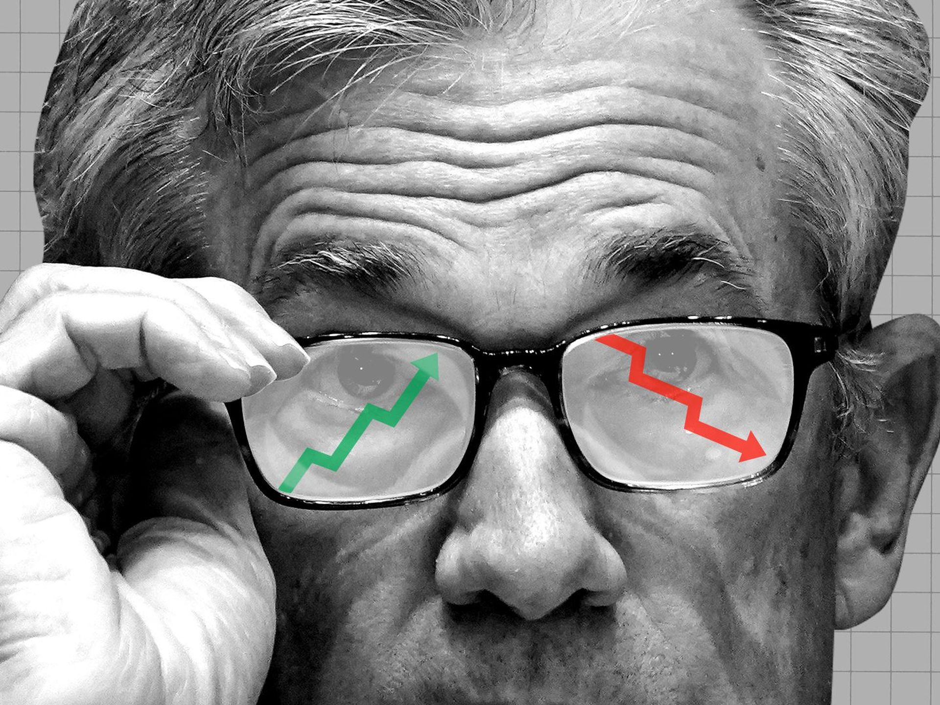 Fragment twarzy szefa Fed, Powella z wizerunkiem spadającego i rosnącego wykresu