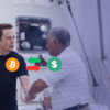 elon musk ściska dłoń pracownikowi jednej ze swoich firm