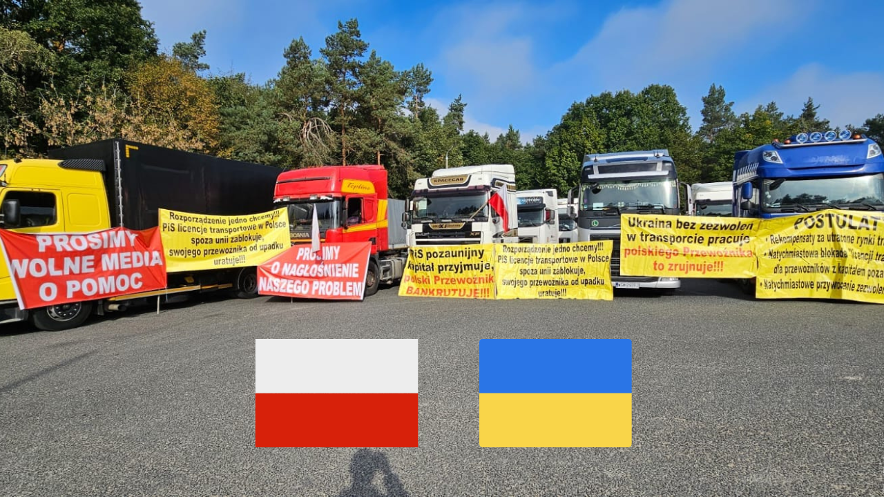 protest truckerów na granicy z ukrainą, na asfalcie polska i ukraińska flaga