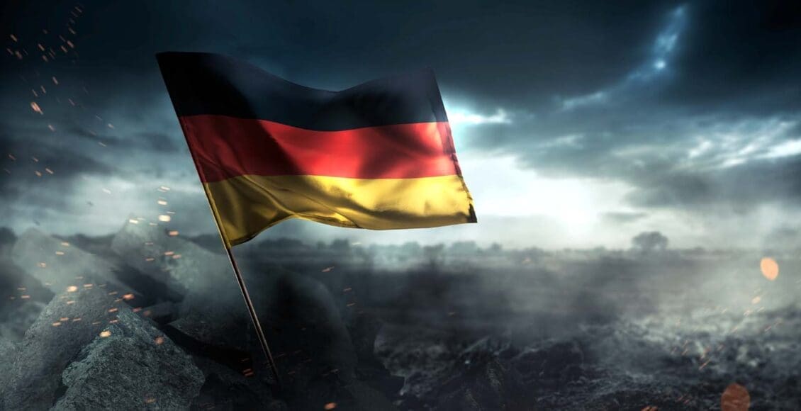 Niemiecka flaga z burzowym niebem w tle
