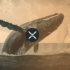 Wieloryb XRP wyskakujący ponad taflę oceanu