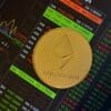Ethereum, w tle wykresy giełdowe