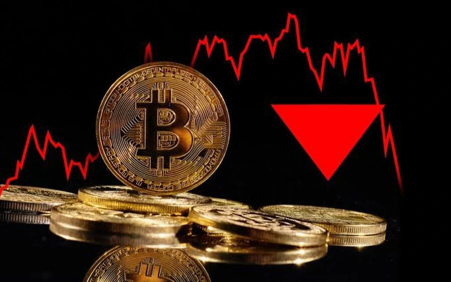 Moneta Bitcoin z czerwonum wykresem w tle
