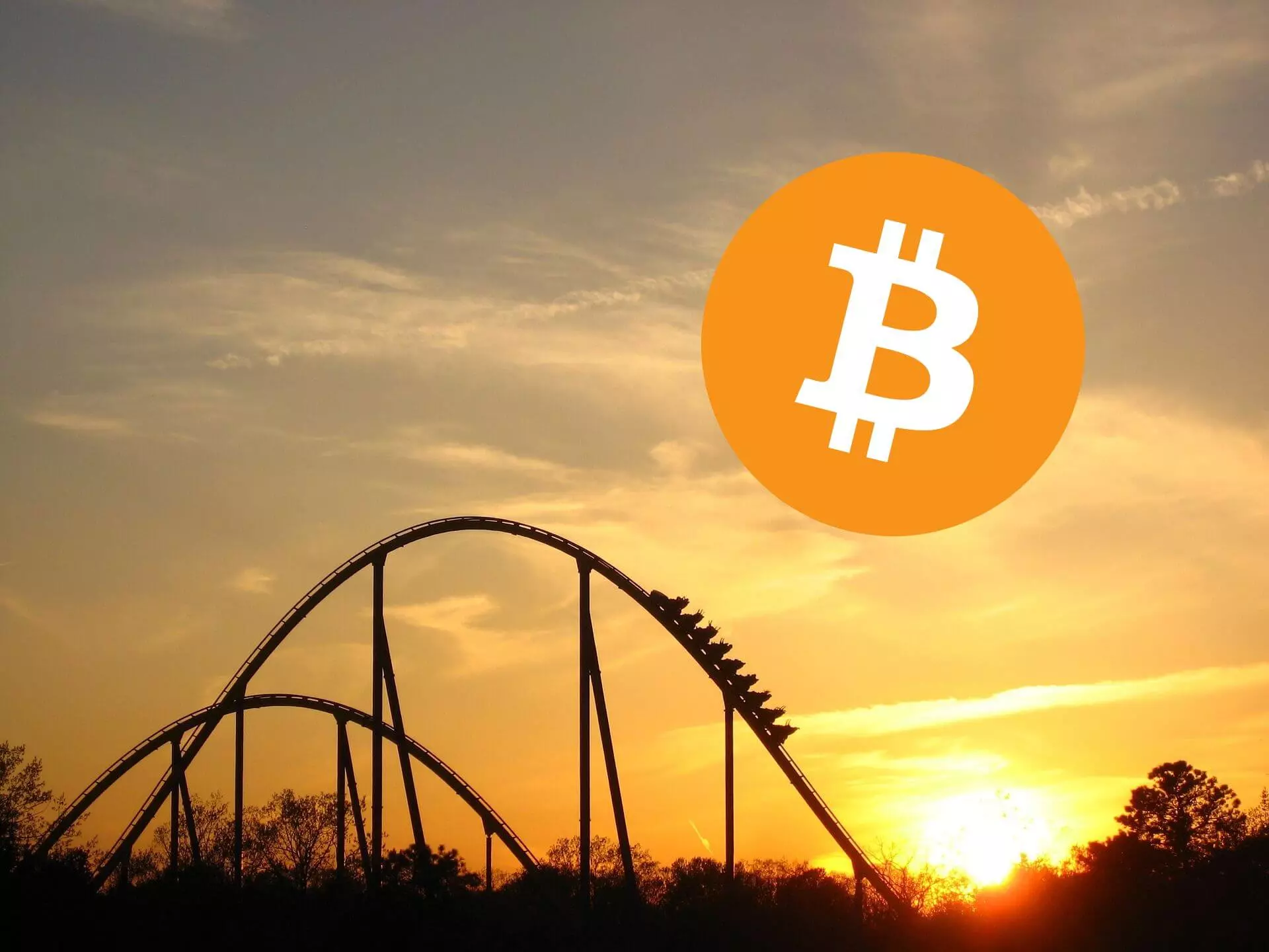 Bitcoin, rollecoaster, zachód słońca w tle