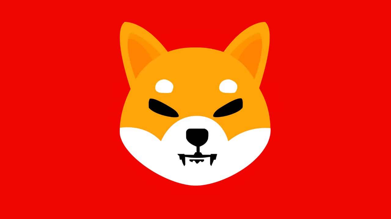 Logo kryptowaluty Shiba Inu (SHIB) na czerwonym jednolitym tle