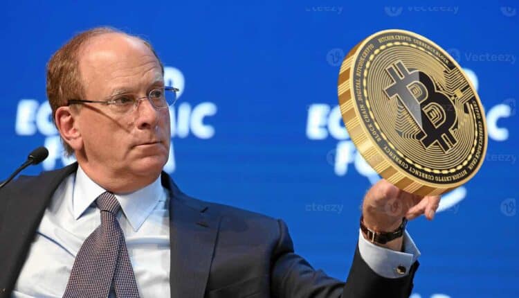 larry fink, ceo blackrock, trzymający monetę bitcoin