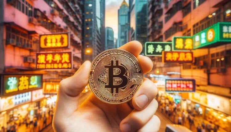 ręka pracownika giełdy kryptowalut w Hongkongu trzymająca Bitcoin