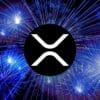 Logo XRP, w tle fajerwerki.