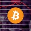 Bitcoin na tle wykresu, który pokazuje krach.