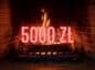 kominek z napisem 5000 zł w tle