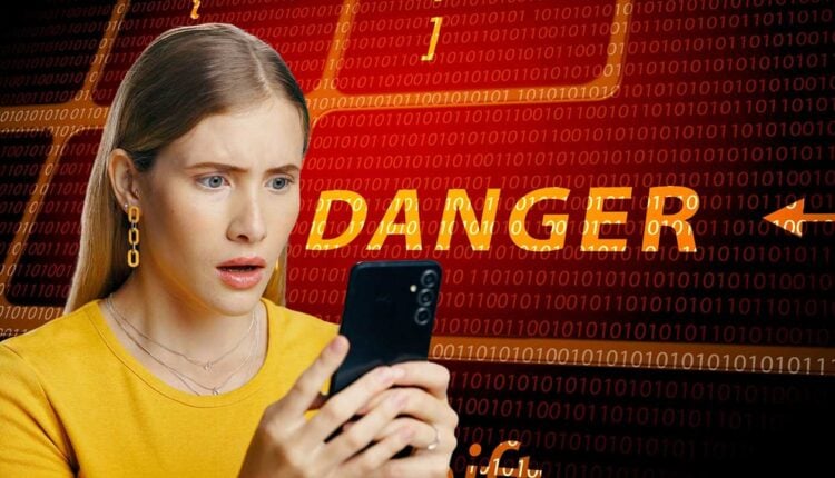 Przerażona kobieta, ofiara ataku oszustów w sieci.