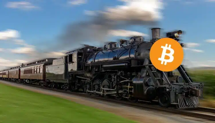 Lokomotywa z logiem Bitcoina pędzi po torach