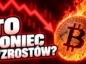 Płonące logo BTC na tle czerwonego wykresu